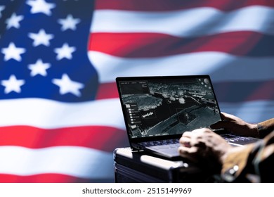 US Air Force officer isolated over USA flag monitoring zone of interest using radar. Close up shot of United States military soldier engaged in surveillance mission using laptop, looking at world map - Powered by Shutterstock