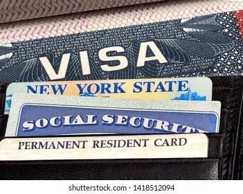 U.S. or America Visa on Passport, Driver License,  Permanent resident or green card and Social Security Card in wallet.