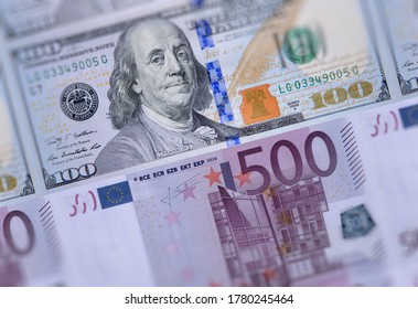 US american 100 dollars bills, European Union currency 500 euro banknotes closeup money background. USA Europe economies relations, business market, trading, payments, financial crisis concept image