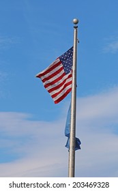 US American And Bergen County, NJ Flags Waving In The Wind With The Beautiful Blue Sky In Background.