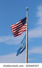 US American And Bergen County, NJ Flags Waving In The Wind With The Beautiful Blue Sky In Background.