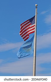 US American And Bergen County, NJ Flags Waving In The Wind With The Beautiful Blue Sky In Background.