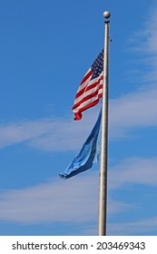 US American And Bergen County, NJ Flags Waving In The Wind With The Beautiful Blue Sky In Background.