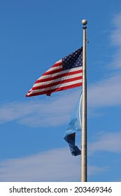 US American And Bergen County, NJ Flags Waving In The Wind With The Beautiful Blue Sky In Background.