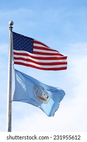 US American And Bergen County, NJ Flags Waving In The Wind With The Beautiful Blue Sky In Background.