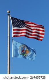 US American And Bergen County, NJ Flags Waving In The Wind With The Beautiful Blue Sky In Background.