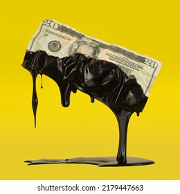 US American Dollar Bill Dripping With Crude Oil Showing The High Cost Of Gas At The Pump Or The USA Dependency On Fossil Fuels.