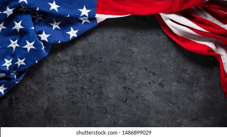 US American flag on worn black background. For USA Memorial day, Veteran's day, Labor day, or 4th of July celebration. With blank space for text.