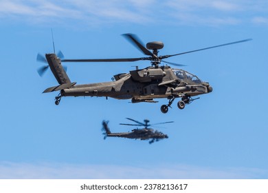 U.S. Army AH-64E Apache helicopter Pilots, assigned to the 16th Combat Aviation Brigade, 7th Infantry Division, fly overhead during training at Yakima Training Center, Wash.