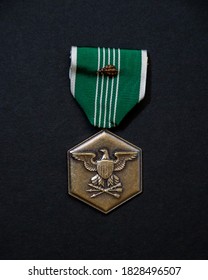 US Army Commendation Medal Against A Dark Background.