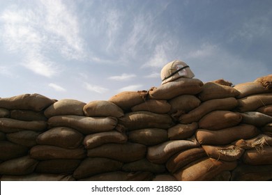 US Army Helmet On Sandbag Bunker.