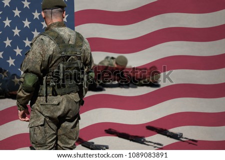 US Army senior drill instructor and new recruits. The sergeant does pushups with her platoon during basic combat training against the background of the Stars and Stripes