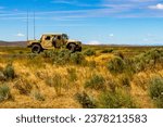 A U.S. Army Soldier, assigned to the 16th Combat Aviation Brigade, 7th Infantry Division, gets in a HUMVEE with Mount Adams in the distance during training at Yakima Training Center, Wash.