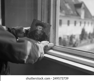 U.S. Army Soldier Holds A Rembrandt Painting Recovered From A Munich Safe. The Army's 'Monuments, Fine Arts, And Archives' Program Was Established In 1943 To Protect Cultural Property In War Areas.