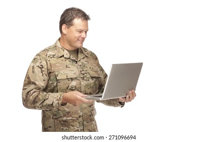 U.S. Army Soldier, Sergeant. Isolated And Smiling At Computer Laptop.