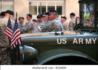 US Army Soldiers Gather In Back Of A Jeep