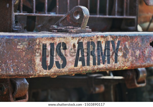 US Army text in part of\
old rust car