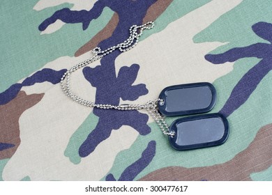 Us Army Woodland  Camouflaged Uniform With Blank Dog Tags Background