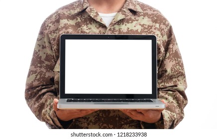 US Army. Young Soldier Showing A Laptop Computer With Blank Screen On White Background