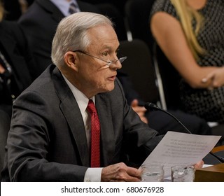 US. Attorney General Jeff Sessions reads his prepared opening statement after being sworn in to testify in front of the Senate Intelligence Committee. Washington DC, June 13, 2017. 