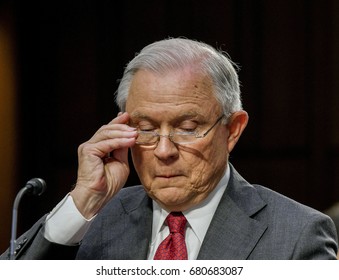 US. Attorney General Jeff Sessions reads from prepared answers in response to a question from one of the members of the Senate Intelligence Committee during his testimony Washington DC, June 13, 2017.