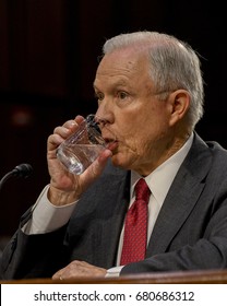 US. Attorney General Jeff Sessions pauses for a drink of water before giving response to a question from members of the Senate Intelligence Committee during his testimony Washington DC, June 13, 2017