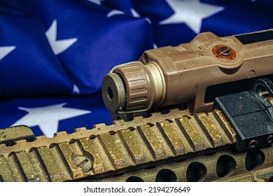 U.S. Battle Flag And Assault Rifle On The Wooden Table.