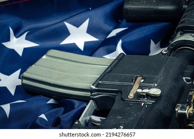 U.S. Battle Flag And Assault Rifle On The Wooden Table.