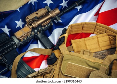 U.S. Battle Flag And Assault Rifle On The Wooden Table.