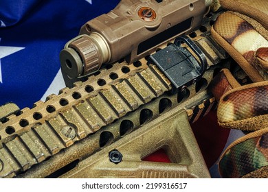 U.S. Battle Flag And Assault Rifle On The Wooden Table.