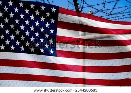 US border wall policy. Prevent illegal immigration and enhance security. National defense. American flag and barbed wire fence. Protection and control. Combat drug trafficking and protect sovereignty.
