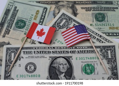 Us And Canadian Flag On A Us Dollar Background