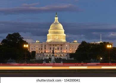 US Capitol Building With Car Lights Trails Foreground At Night