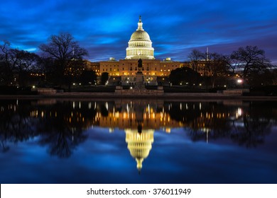 US Capitol Building and reflection at sunrise - Washington DC, USA