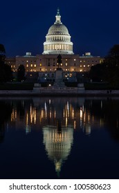 US Capitol Building In Washington DC At Night With Mirror Reflection On Pool