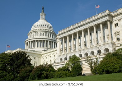 The US Capitol Building Where The House Of Representatives Is In Session Under The Flag Flying On The Right.