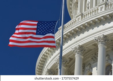 U.S. Capitol Dome  And Waving US National Flag Close-up - Washington D.C. United States Of America