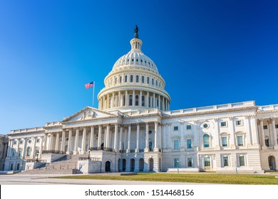 US Capitol over blue sky - Shutterstock ID 1514468156