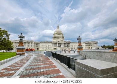 US Capitol West Front With Dramatic Storm Clouds Above Washington DC Government Landmark And Plaza