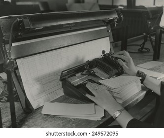 U.S. Census Worker Transferring Information From A Questionnaire To A Punch Card, Ca. 1940.