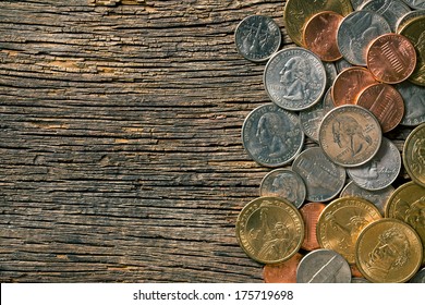 the U.S. coins on old wooden background