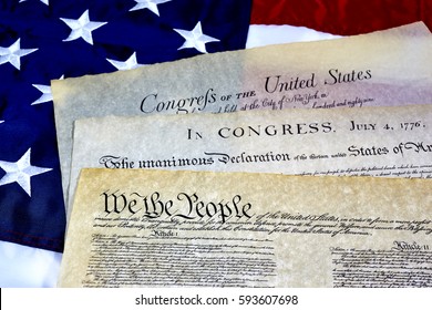 US Constitution With Bill Of Rights And Declaration Of Independence On An American Flag