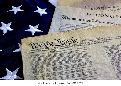 US Constitution With Bill Of Rights And Declaration Of Independence On An American Flag