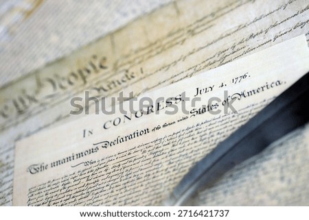 US Constitution with Declaration Of Independence and Quill Pen close up. Patriotism, Fourth of July background