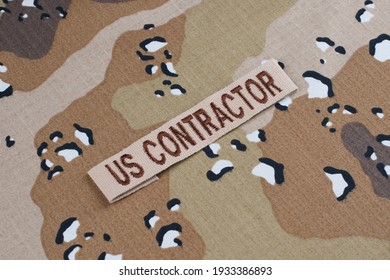 US CONTRACTOR Branch Tape On Desert Camouflage Uniform Background