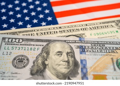 US Dollar Banknotes Money On USA America Flag, Finance Banking Concept.