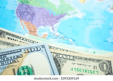 US Dollar Banknotes On Blur World Map Background : Banking Account, Investment Analytic Research Data Economy, Trading, Business Company Concept.          