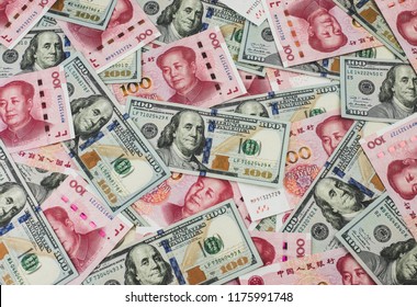 US Dollar Bill And Chinese Yuan Banknote. USD Vs RMB.