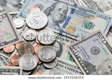 US Dollar Bills and Coins. Dollar Banknotes as Background, distributed USD. banknotes from one to one hundred Dollar Bills. Cash piled up