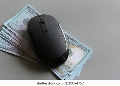 US dollar and computer mouse. Pay per click, online banking, shopping and business concept